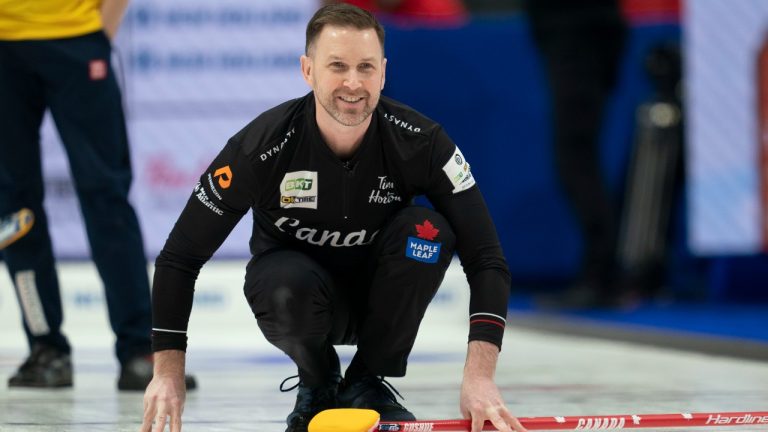 Canadian skip Brad Gushue smiles as his shot enters the house during fifth end action against Team Sweden in the qualification game at the Men's World Curling Championship, Saturday, April 8, 2023 in Ottawa. (Adrian Wyld/CP)