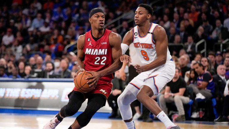 Miami Heat forward Jimmy Butler (22) drives against New York Knicks guard RJ Barrett (9) during the first half of Game 1 in the NBA basketball Eastern Conference semifinals playoff series. (John Minchillo/AP)