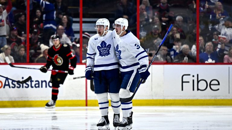 Toronto Maple Leafs left wing Michael Bunting (58) celebrates his goal with defenceman Justin Holl (3) during second period NHL hockey action against the Ottawa Senators in Ottawa, on Saturday, April 1, 2023. (Justin Tang/CP)