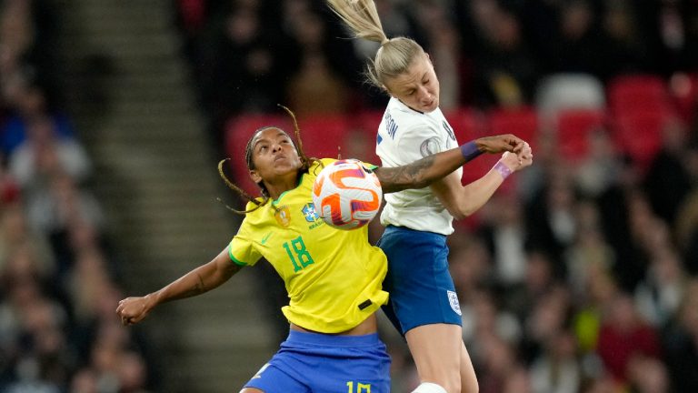 England's Leah Williamson vies for the ball with Brazil's Geyse, left, during the Women's Finalissima soccer match between England and Brazil at Wembley stadium in London, Thursday, April 6, 2023. (Kirsty Wigglesworth/AP)