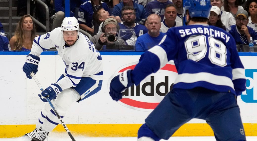 Tampa Bay Lightning defenseman Mikhail Sergachev (98) warms up