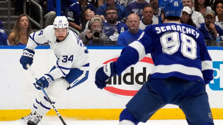 Toronto Maple Leafs center Auston Matthews (34) stops short in front of Tampa Bay Lightning defenseman Mikhail Sergachev (98) during the first period in Game 6 of an NHL hockey Stanley Cup first-round playoff series Saturday, April 29, 2023, in Tampa, Fla. (Chris O'Meara/AP)