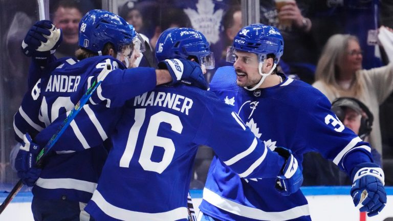 Toronto Maple Leafs right wing William Nylander (88) celebrates his goal against the Tampa Bay Lightning with teammates Mitchell Marner (16) and Auston Matthews (34) during first period NHL first round Stanley Cup playoff hockey action in Toronto, on Thursday, April 20, 2023. (Frank Gunn/CP)