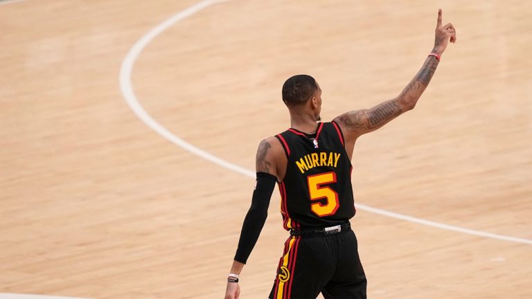 Atlanta Hawks guard Dejounte Murray gestures after a win against the Boston Celtics during the second half of Game 3 of a first-round NBA basketball playoff series, Friday, April 21, 2023, in Atlanta. (Brynn Anderson/AP)