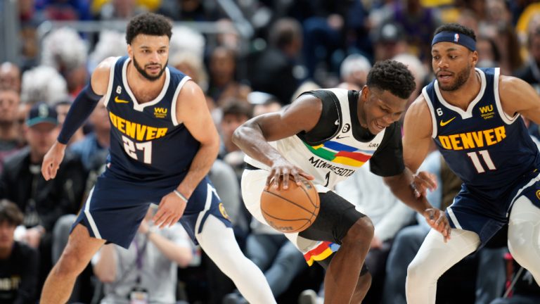 Minnesota Timberwolves guard Anthony Edwards, center, struggles to control the ball as Denver Nuggets guard Jamal Murray, left, and forward Bruce Brown defend during the second half of Game 2 of an NBA basketball first-round playoff series Wednesday, April 19, 2023, in Denver. (David Zalubowski/AP)