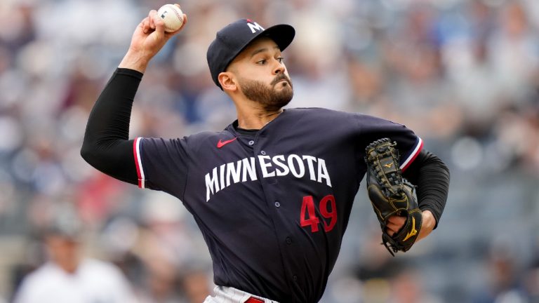 Minnesota Twins starting pitcher Pablo Lopez (49) throws in the first inning of a baseball game against the New York Yankees, Sunday, April 16, 2023, in New York. (John Minchillo/AP)