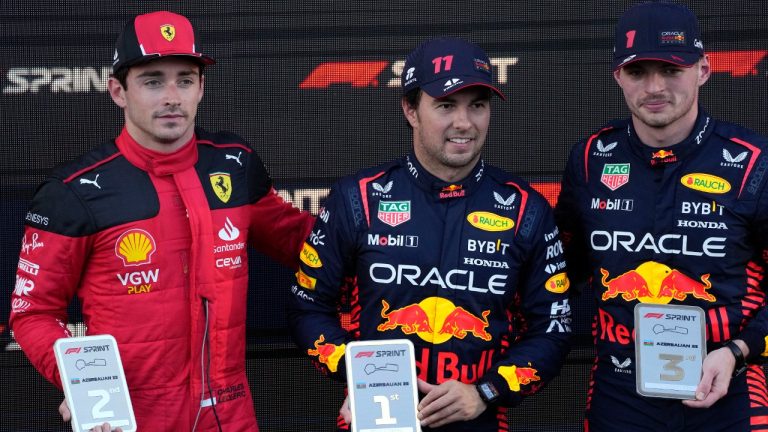 Second placed Ferrari driver Charles Leclerc, left, of Monaco, third placed Red Bull driver Max Verstappen, right, of the Netherlands and first placed Red Bull driver Sergio Perez of Mexico celebrate after the sprint race at the Baku circuit in Baku, Azerbaijan, Saturday, April 29, 2023. The Formula One Grand Prix will be held on Sunday April 30, 2023. (Darko Bandic/AP)