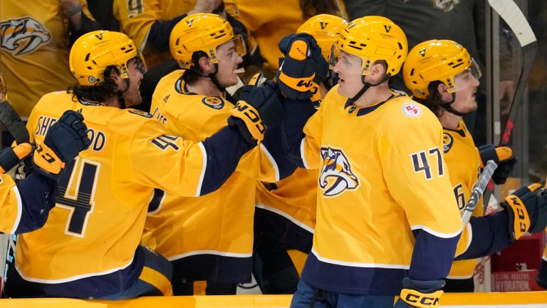 Nashville Predators right wing Michael McCarron (47) is congratulated forhis goal against the Carolina Hurricanes during the first period of an NHL hockey game Thursday, April 6, 2023, in Nashville, Tenn. (Mark Humphrey/AP)