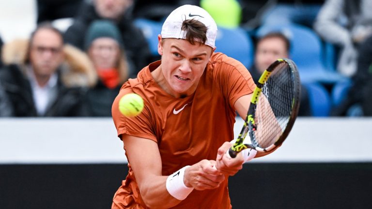 Holger Rune from Denmark returns the ball to Germany's Yannick Hanfmann during an ATP Tour tennis match in Munich, Germany, Thursday, April 20, 2023. (Sven Hoppe/dpa via AP)