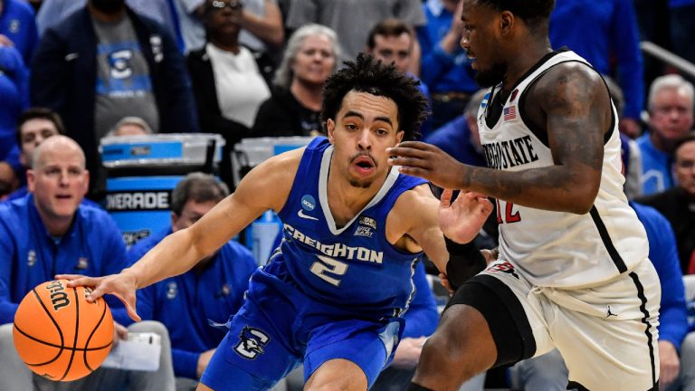 Creighton guard Ryan Nembhard (2) moves the ball against San Diego State guard Darrion Trammell (12) in the second half of a Elite 8 college basketball game in the South Regional of the NCAA Tournament, Sunday, March 26, 2023, in Louisville, Ky. (Timothy D. Easley/AP)