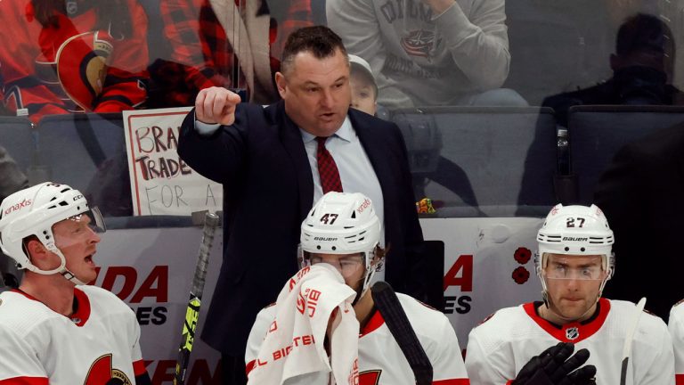 Ottawa Senators coach D.J. Smith, center top, directs his team during the third period of an NHL hockey game against the Columbus Blue Jackets. (Paul Vernon/AP)