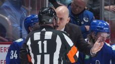 Controversial penalty call by linesman looms large in Canucks&#8217; loss to Flames