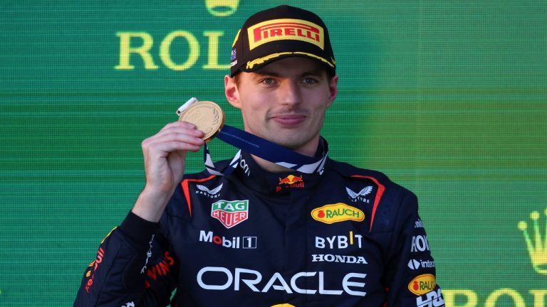 Red Bull driver Max Verstappen of Netherlands holds up a medal while on the podium after wining the Australian Formula One Grand Prix at Albert Park in Melbourne, Sunday, April 2, 2023. (Asanka Brendon Ratnayake/AP)