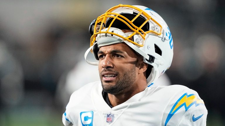 Los Angeles Chargers running back Austin Ekeler (30) warms up before an NFL wild-card football game against the Jacksonville Jaguars, Saturday, Jan. 14, 2023, in Jacksonville, Fla. The Los Angeles Chargers have avoided a holdout by running back Austin Ekeler, by adding $1.75 million in incentives to his contract for the upcoming season according to a person with knowledge of the deal. (AP Photo/Chris Carlson, File)