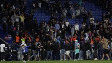 Early end to Barcelona&#8217;s title celebrations after Espanyol fans invade pitch