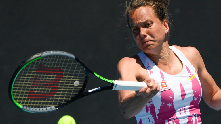 Barbora Strycova of the Czech Republic makes a forehand return to Russia's Svetlana Kuznetsova during their first round match at the Australian Open tennis championship in Melbourne, Australia, Tuesday, Feb. 9, 2021.(AP Photo/Andy Brownbill)