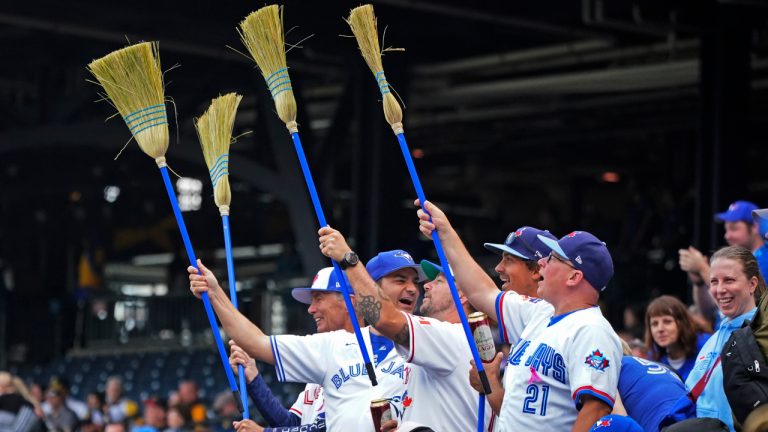 Toronto Blue Jays fans get out their brooms as the Blue Jays get the final out of a win over the Pittsburgh Pirates in a baseball game in Pittsburgh, Sunday, May 7, 2023, to sweep a three-game series. (Gene J. Puskar/AP)