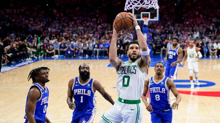 Boston Celtics' Jayson Tatum (0) shoots against Philadelphia 76ers' Tyrese Maxey (0), James Harden (1), and De'Anthony Melton (8) during the first half of Game 6 of an NBA basketball playoffs Eastern Conference semifinal, Thursday, May 11, 2023, in Philadelphia. (Matt Slocum/AP)