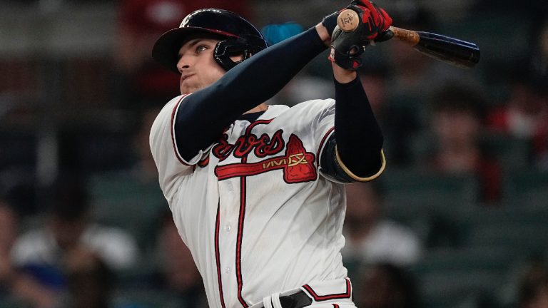 Atlanta Braves' Austin Riley watches his solo home run during the fifth inning of the team's baseball game against the Philadelphia Phillies, Thursday, May 25, 2023, in Atlanta. (John Bazemore/AP)