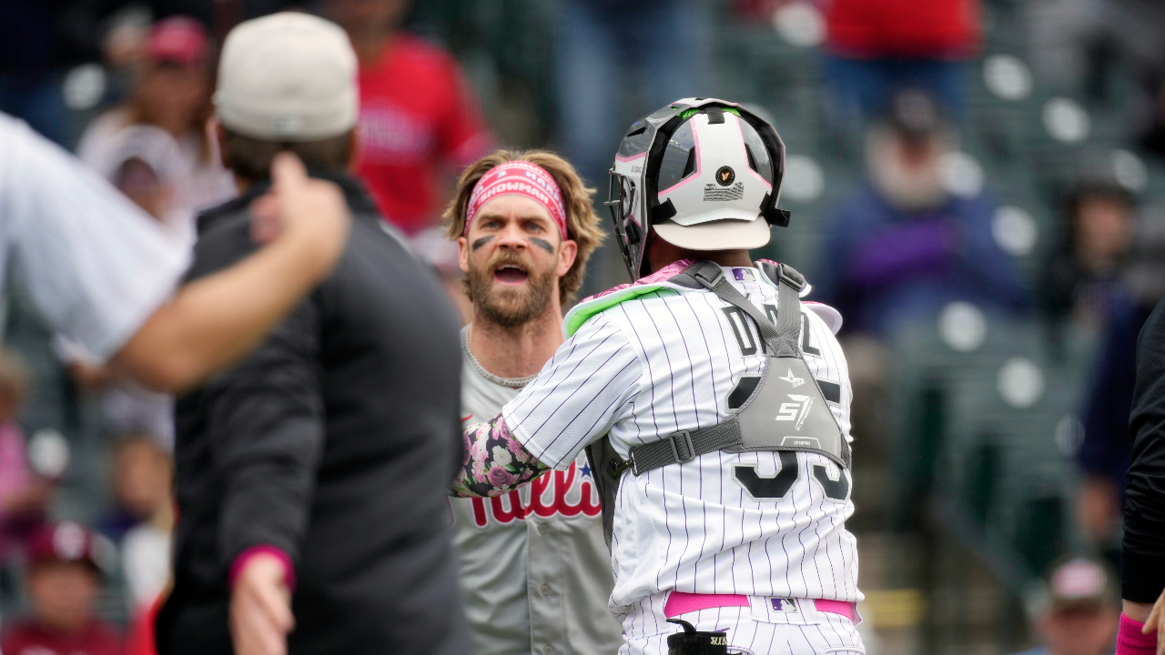 Phillies' Bryce Harper ejected after charging Rockies dugout