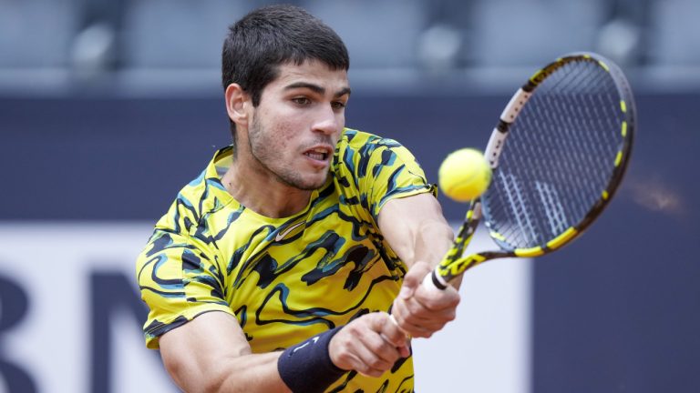 Carlos Alcaraz returns the ball to Fabian Marozsan at the Italian Open tennis tournament, in Rome, Monday, May 15, 2023. (Andrew Medichini/AP)