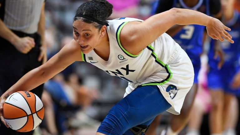 Minnesota Lynx Natalie Achonwa reels in a loose ball along the sideline during the team's WNBA basketball game against the Connecticut Sun on Thursday, Aug. 19, 2021, in Uncasville, Conn. (Sean D. Elliot/The Day via AP)