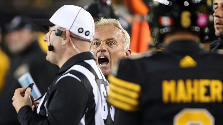 Hamilton Tiger-Cats special teams co-ordinator, Jeff Reinebold, yells at a referee following an attempted on-side kick by the Hamilton Tiger-Cats late in the second-half of CFL football action against the Edmonton Eskimos in Hamilton on Friday, October 28, 2016. THE CANADIAN PRESS/Peter Power