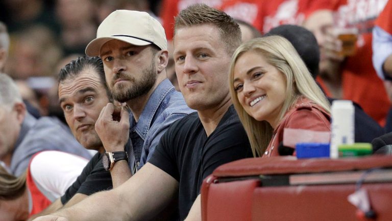 Former NFLer J.J. Watt and his wife, Kealia, are seen at an NBA game in 2018, sitting next to singer Justin Timberlake. (David J. Phillip/AP) 