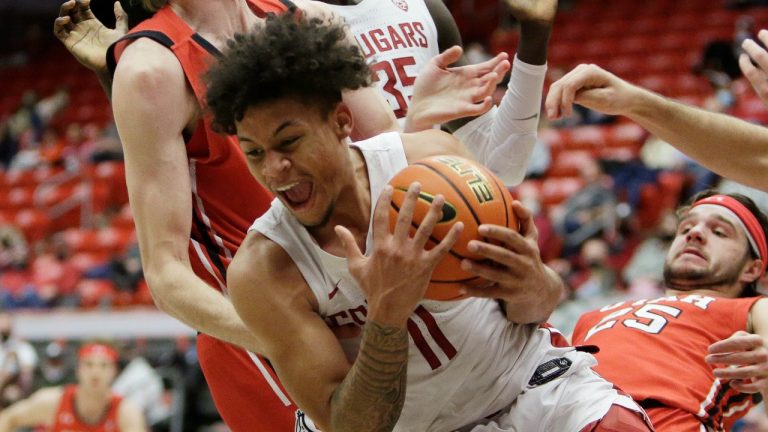 Washington State forward DJ Rodman secures a rebound during the second half of an NCAA college basketball game against Utah, Wednesday, Jan. 26, 2022, in Pullman, Wash. Washington State won 71-54. (Young Kwak/AP)