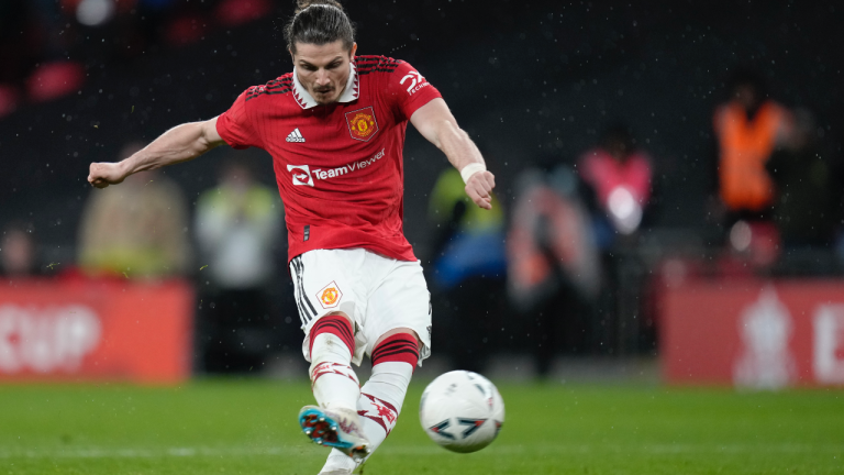 Manchester United's Marcel Sabitzer scores a penalty kick during the English FA Cup semifinal soccer match between Brighton and Hove Albion and Manchester United at Wembley Stadium in London, Sunday, April 23, 2023. (AP Photo/Kirsty Wigglesworth)