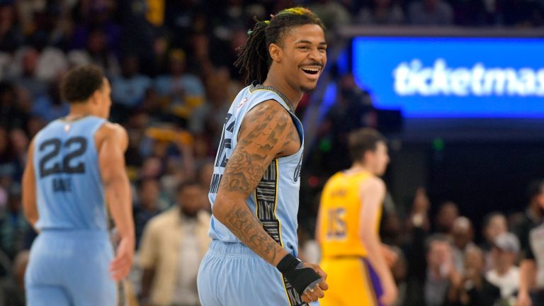 Memphis Grizzlies guard Ja Morant (12) reacts during the second half of Game 5 of the team's first-round NBA basketball playoff series against the Los Angeles Lakers on Wednesday, April 26, 2023, in Memphis, Tenn. (AP Photo/Brandon Dill)