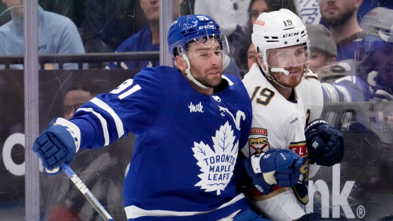 Toronto Maple Leafs centre John Tavares (91) checks Florida Panthers left wing Matthew Tkachuk (19) during first period, second round, game one, NHL Stanley Cup hockey action in Toronto, Tuesday, May 2, 2023. (CP)