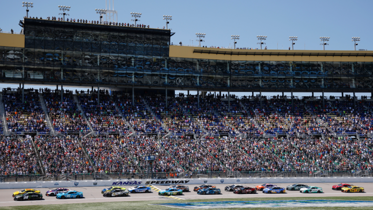 Drivers head down the front straightaway at the start of a NASCAR Cup Series auto race at Kansas Speedway in Kansas City, Kan., Sunday, May 7, 2023. (AP Photo/Colin E. Braley)