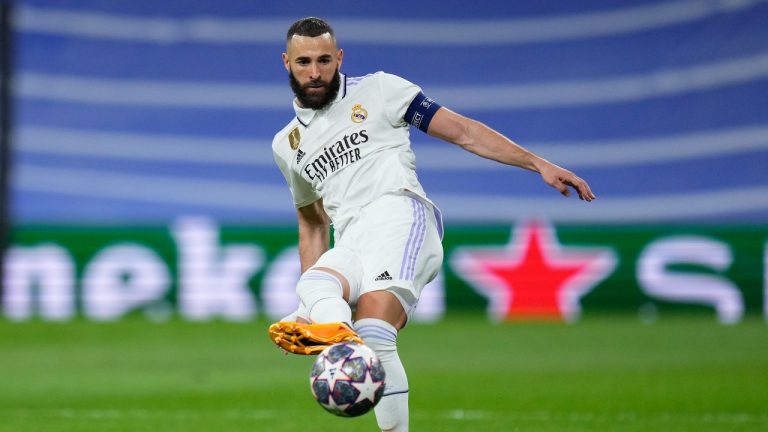 Real Madrid's Karim Benzema passes the ball during the Champions League semifinal first leg soccer match between Real Madrid and Manchester City at the Santiago Bernabeu stadium in Madrid, Spain, Tuesday, May 9, 2023. (Manu Fernandez/AP)