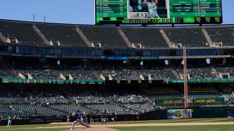 Texas Rangers pitcher Jon Gray (22) throws to an Oakland Athletics batter during the eighth inning of a baseball game in Oakland, Calif., Saturday, May 13, 2023. (AP Photo/Jeff Chiu)