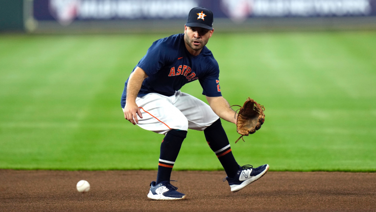 Houston Astros' Jose Altuve fields a ground ball during batting practice before a baseball game against the Chicago Cubs Monday, May 15, 2023, in Houston. (AP Photo/David J. Phillip)