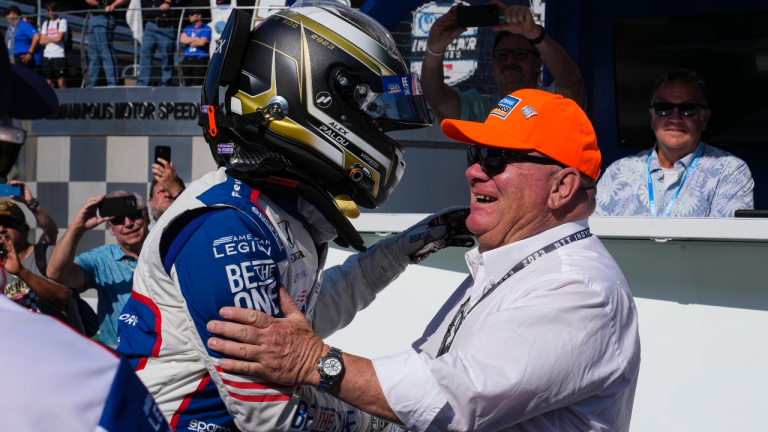 Alex Palou, of Spain, celebrates with car owner Chip Ganassi during qualifications for the Indianapolis 500 auto race at Indianapolis Motor Speedway in Indianapolis, Sunday, May 21, 2023. Palou won the pole for the race. (AP Photo/Michael Conroy)