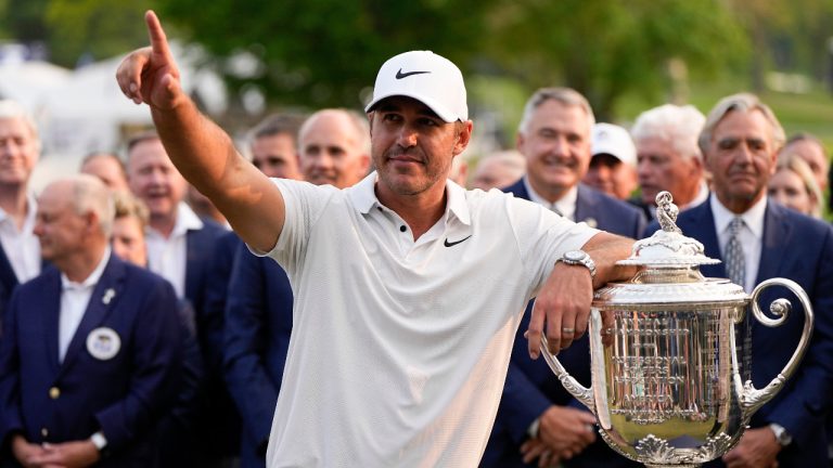 Brooks Koepka celebrates with the Wanamaker trophy after winning the PGA Championship golf tournament at Oak Hill Country Club on Sunday, May 21, 2023, in Pittsford, N.Y.(Eric Gay/AP) 