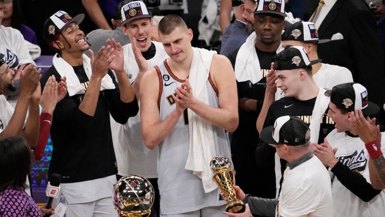 Denver Nuggets center Nikola Jokic, center, is presented with the series MVP trophy after defeating the Los Angeles Lakers in Game 4 of the NBA basketball Western Conference Final series Monday, May 22, 2023, in Los Angeles. (Mark J. Terrill/AP)