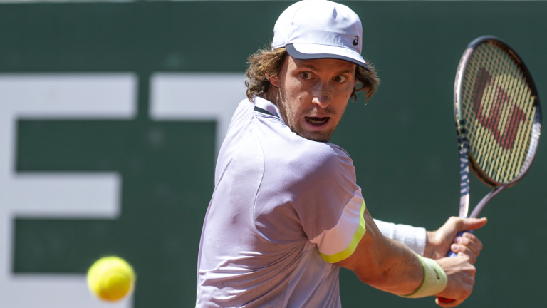 Nicolas Jarry of Chile returns a ball to Grigor Dimitrov of Bulgaria during their final match at the ATP 250 Geneva Open tennis tournament in Geneva, Switzerland, Saturday, May 27, 2023. (AP)