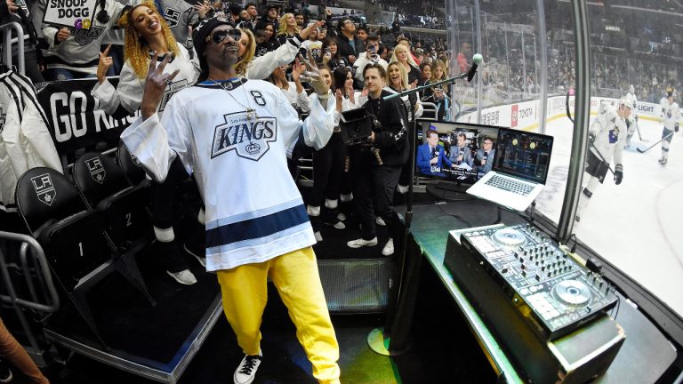 Rapper Snoop Dogg DJ's prior to an NHL hockey game between the Los Angeles Kings and the Colorado Avalanche Saturday, Feb. 22, 2020, in Los Angeles. (\Mark J. Terrill/AP) 