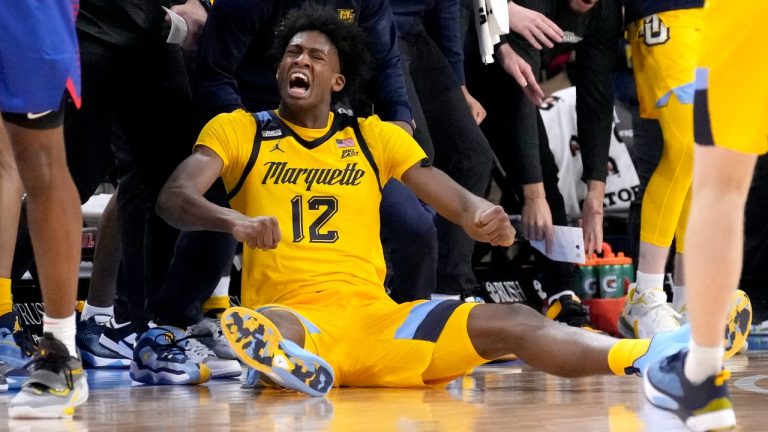 Marquette's Olivier-Maxence Prosper reacts after making a three-point shot and getting fouled during the second half of a game against DePau. (Charles Rex Arbogast/AP)