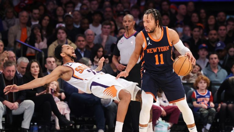 New York Knicks guard Jalen Brunson (11) dribbles as Phoenix Suns guard Cameron Payne falls backward during the second half of an NBA basketball game, Monday, Jan. 2, 2023, in New York. (Jessie Alcheh/AP)