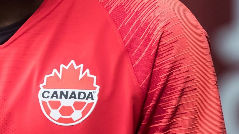 The Canada Soccer logo is seen on the jersey of one of the national team's players. (CP)