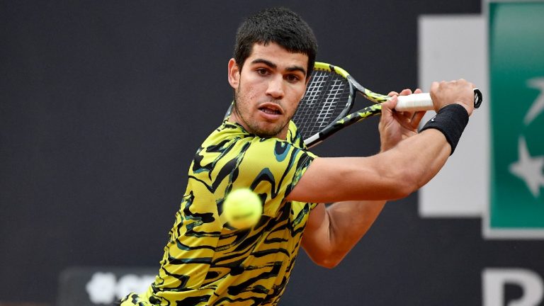 Carlos Alcaraz of Spain returns the ball to Albert Ramos-Vinolas of Spain during their match at the Italian Open tennis tournament, in Rome, Saturday, May 13, 2023. (Antonietta Baldassarre/AP)