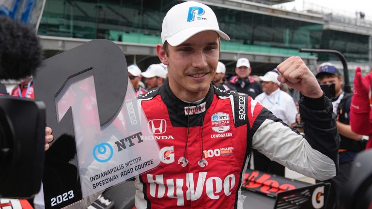 Christian Lundgaard, of Denmark, celebrates after winning the pole for the IndyCar Grand Prix auto race at Indianapolis Motor Speedway, Friday, May 12, 2023, in Indianapolis. (Darron Cummings/AP)