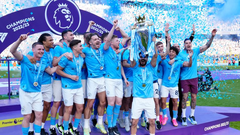 Manchester City players celebrate their Premier League title after the English Premier League soccer match between Manchester City and Chelsea at the Etihad Stadium in Manchester, England, Sunday, May 21, 2023. (Jon Super/AP)