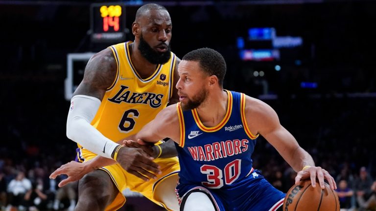 Los Angeles Lakers forward LeBron James (6) defends against Golden State Warriors guard Stephen Curry (30) during the second half of an NBA basketball game. (Ashley Landis/AP)