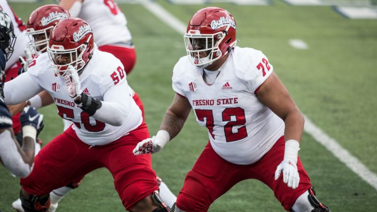 Dontae Bull #72 of the Fresno State Bulldogs protects quarterback Jake Haener #9 during their game against the Utah State Aggies on November 14, 2020 at Maverick Stadium in Logan, Utah. (Chris Gardner/Getty Images)