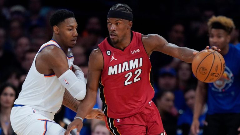 Miami Heat forward Jimmy Butler drives around New York Knicks guard RJ Barrett during the second half of Game 1 in the NBA basketball Eastern Conference semifinals playoff series, Sunday, April 30, 2023, in New York. (AP)